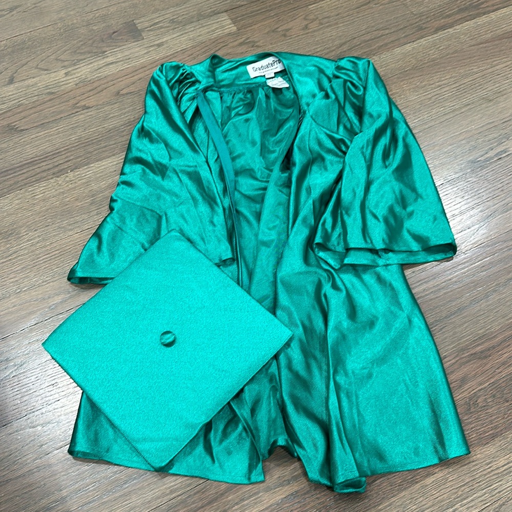 Green graduation cap and gown. Kids